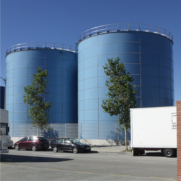 two blue anaerobic digester tanks